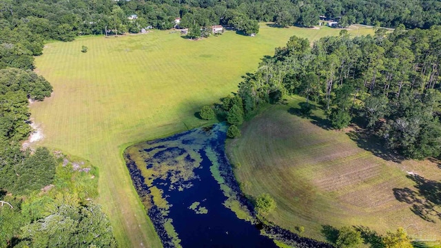 aerial view with a rural view and a water view