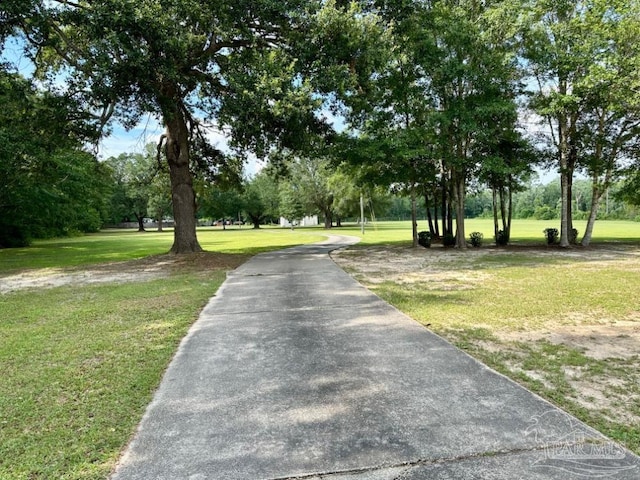 surrounding community featuring a lawn