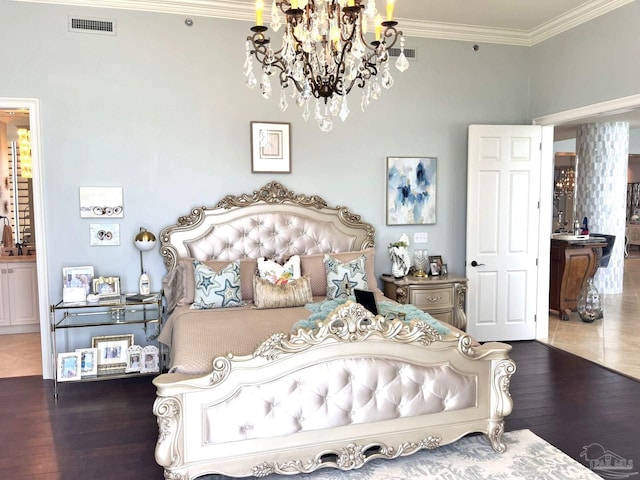 bedroom featuring tile patterned floors, crown molding, and a chandelier