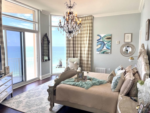 bedroom with access to outside, a water view, a chandelier, hardwood / wood-style flooring, and ornamental molding