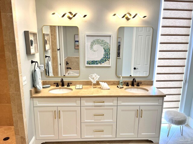 bathroom featuring dual vanity and tile patterned floors