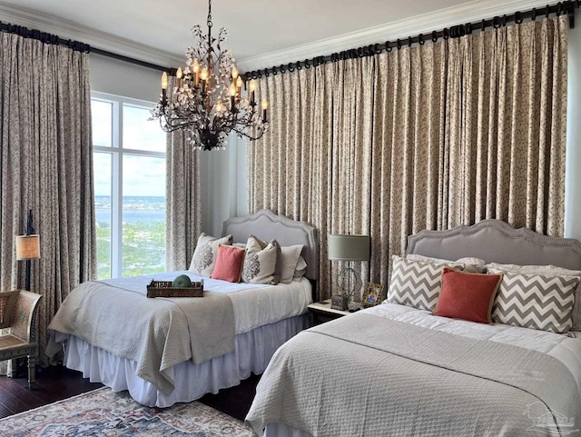 bedroom featuring an inviting chandelier, wood-type flooring, and ornamental molding