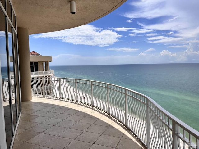 balcony featuring a water view