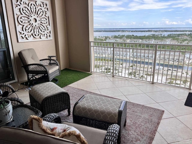 balcony featuring a water view