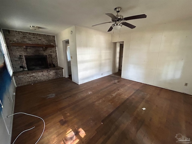 unfurnished living room featuring a ceiling fan, a fireplace, and wood finished floors