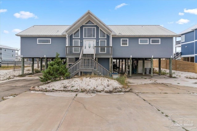 back of property with a carport