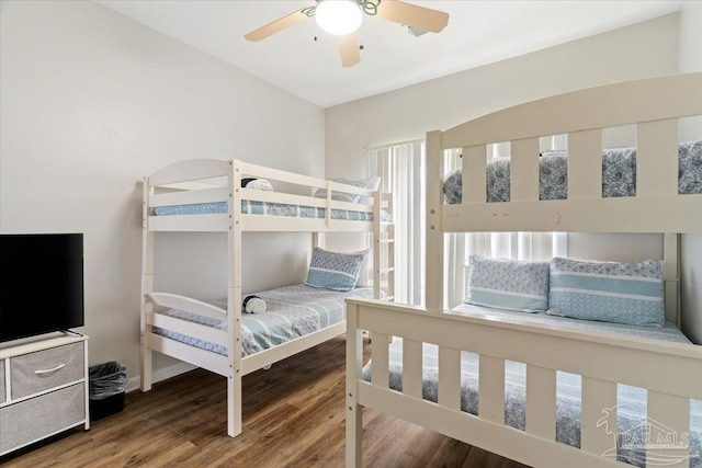 bedroom with ceiling fan and wood-type flooring