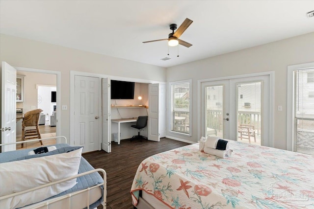 bedroom featuring built in desk, french doors, access to outside, dark wood-type flooring, and ceiling fan