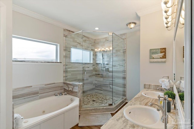 bathroom with crown molding, vanity, and shower with separate bathtub