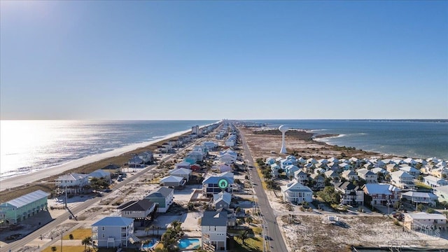 birds eye view of property with a water view and a view of the beach