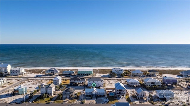 aerial view featuring a water view and a beach view