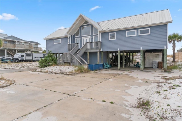 rear view of house featuring a carport