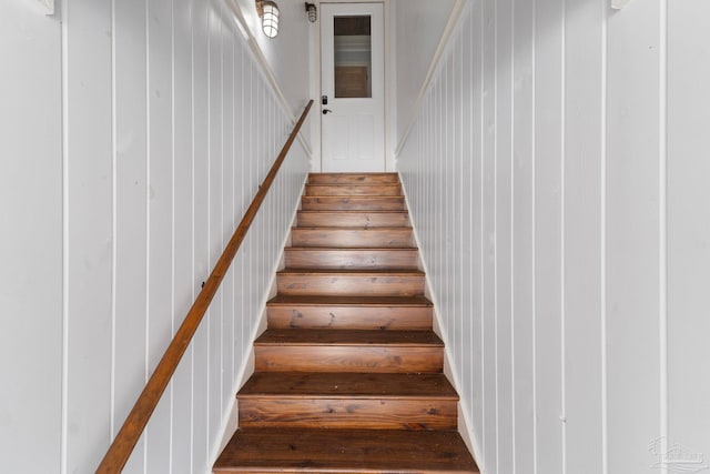 stairs with hardwood / wood-style flooring