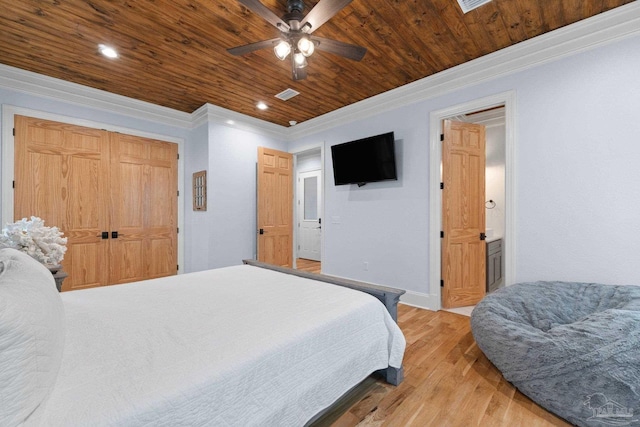 bedroom featuring ceiling fan, wooden ceiling, light hardwood / wood-style flooring, crown molding, and a closet