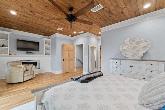 bedroom with ceiling fan, light wood-type flooring, wood ceiling, and crown molding