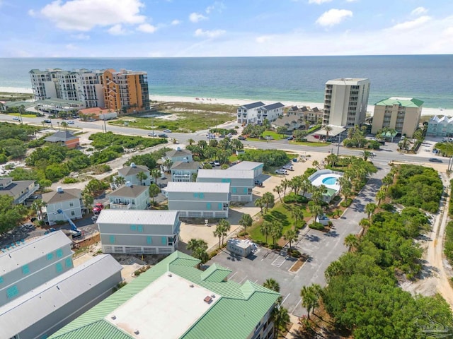 birds eye view of property featuring a water view and a view of the beach