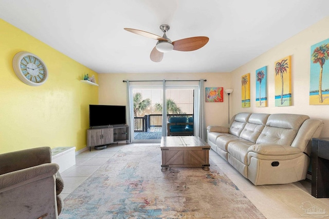 tiled living room with ceiling fan