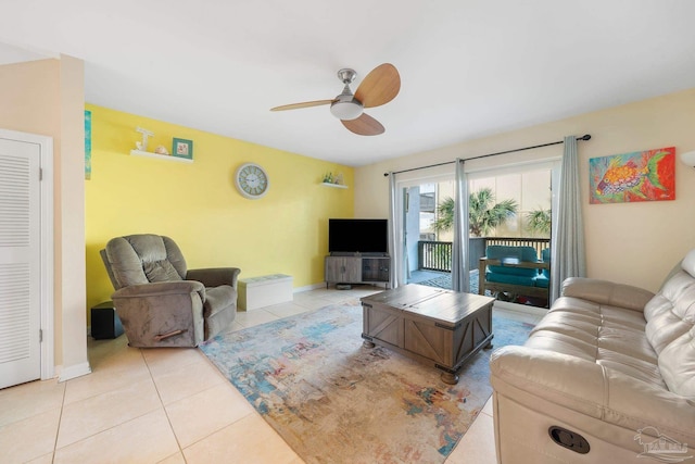 tiled living room with ceiling fan