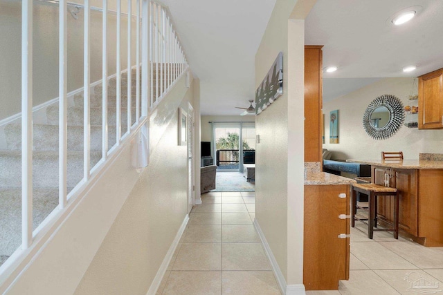 corridor featuring light tile patterned flooring