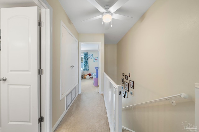 corridor with light colored carpet