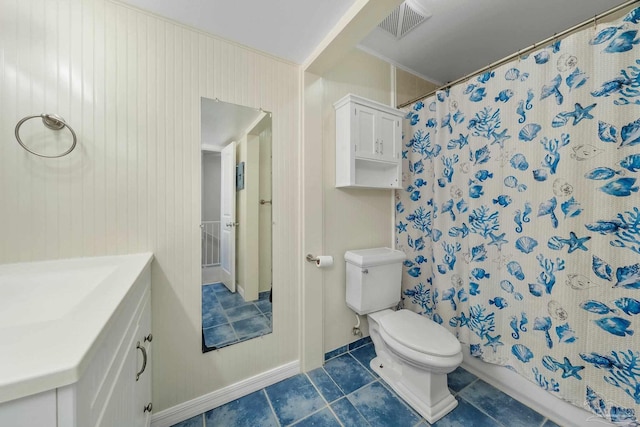 bathroom with a shower with shower curtain, tile patterned flooring, vanity, and toilet