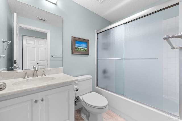 375 Beach Club Trl Unit A1801, Gulf Shores, AL 36542 - full bath featuring a textured ceiling, toilet, vanity, and combined bath / shower with glass door