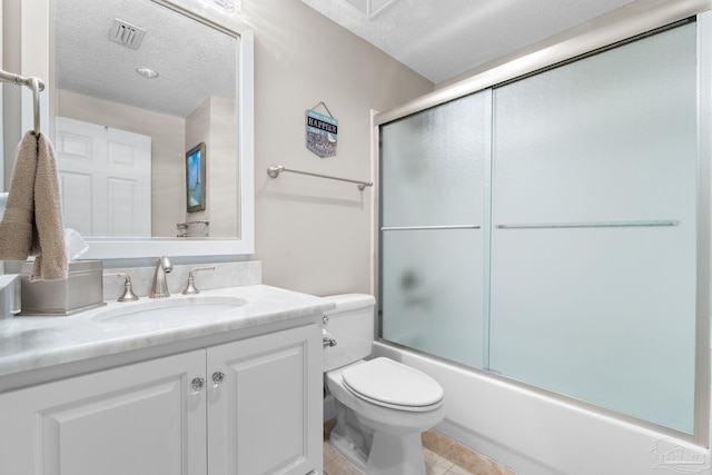375 Beach Club Trl Unit A1801, Gulf Shores, AL 36542 - full bathroom featuring a textured ceiling, vanity, toilet, and shower / bath combination with glass door