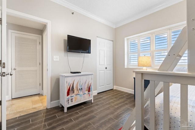 375 Beach Club Trl Unit A1801, Gulf Shores, AL 36542 - bedroom featuring crown molding, dark wood-type flooring, and baseboards