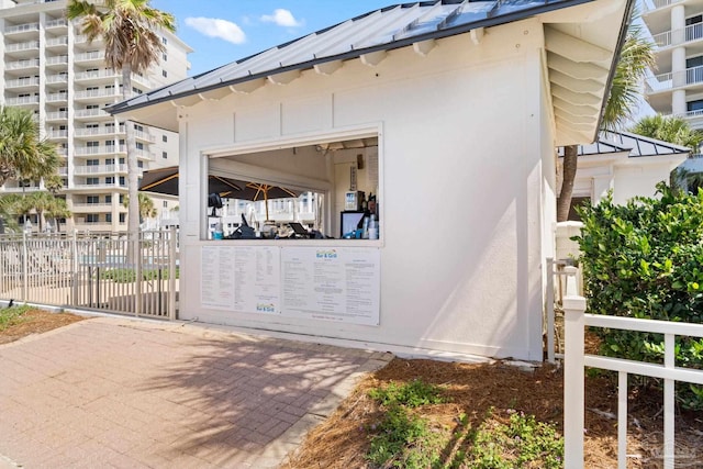 375 Beach Club Trl Unit A1801, Gulf Shores, AL 36542 - view of side of property with stucco siding and metal roof
