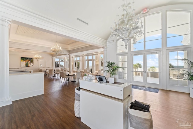 375 Beach Club Trl Unit A1801, Gulf Shores, AL 36542 - kitchen featuring french doors, a chandelier, ornamental molding, dark wood finished floors, and decorative light fixtures
