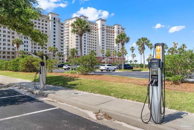 375 Beach Club Trl Unit A1801, Gulf Shores, AL 36542 - surrounding community with uncovered parking and a lawn