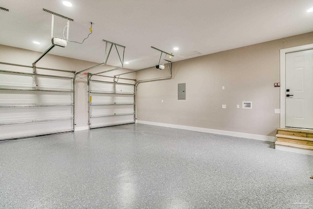 garage featuring electric panel and a garage door opener