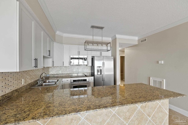 kitchen featuring stainless steel appliances, sink, kitchen peninsula, backsplash, and ornamental molding