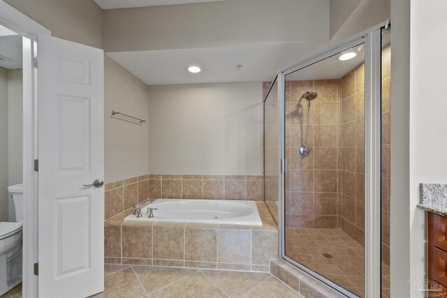 full bathroom with vanity, plus walk in shower, tile patterned flooring, and toilet