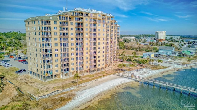 view of property featuring a beach view and a water view