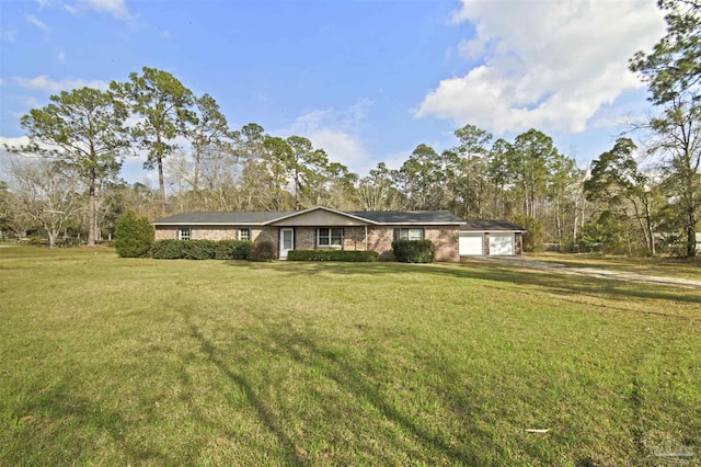 single story home featuring a garage and a front yard