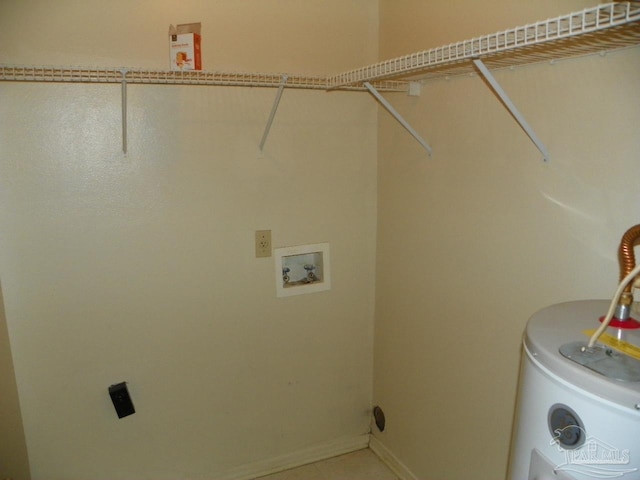 laundry room with washer hookup, laundry area, water heater, and baseboards