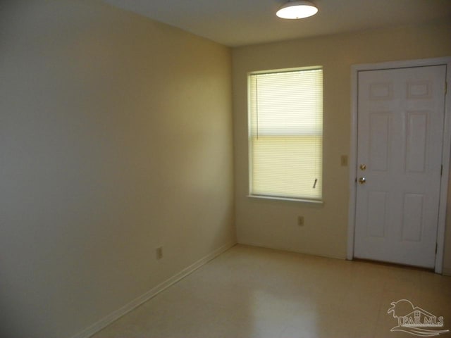 empty room with baseboards