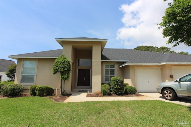 3756 Bengal Rd, Gulf Breeze, FL 32563 - view of front facade featuring a garage, stucco siding, roof with shingles, and a front yard