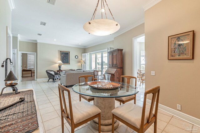3756 Bengal Rd, Gulf Breeze, FL 32563 - dining area with visible vents, ornamental molding, baseboards, and light tile patterned floors