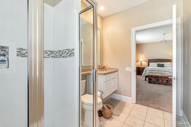 3756 Bengal Rd, Gulf Breeze, FL 32563 - ensuite bathroom featuring tile patterned flooring, vanity, a ceiling fan, ensuite bathroom, and a stall shower