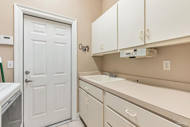 3756 Bengal Rd, Gulf Breeze, FL 32563 - clothes washing area with a sink, cabinet space, and light tile patterned flooring
