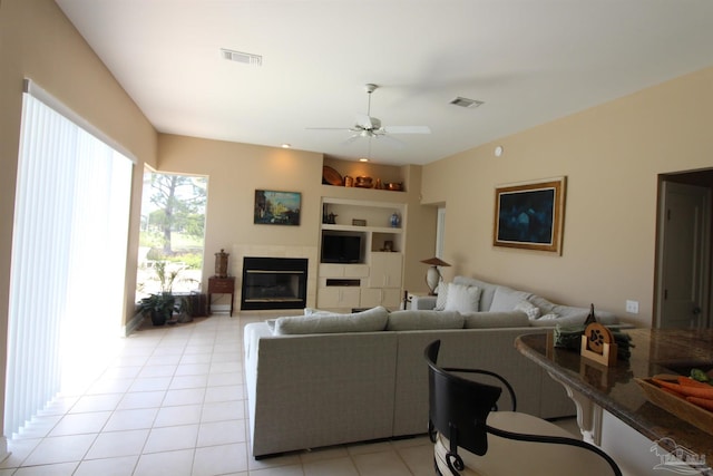 3756 Bengal Rd, Gulf Breeze, FL 32563 - living area featuring ceiling fan, visible vents, built in shelves, and light tile patterned floors