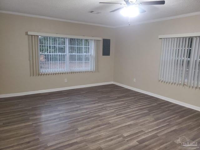 spare room with dark hardwood / wood-style flooring, ceiling fan, crown molding, and a textured ceiling