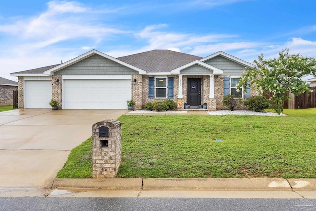 4744 Perception Cir, Milton, FL 32570 - view of front of property with an attached garage, driveway, and brick siding