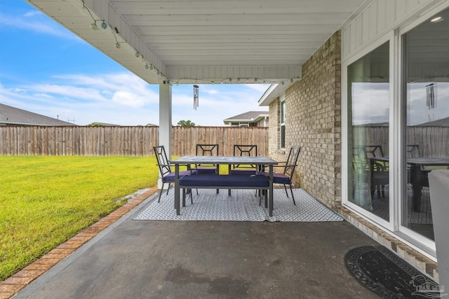 4744 Perception Cir, Milton, FL 32570 - fenced backyard with outdoor dining area and a patio area