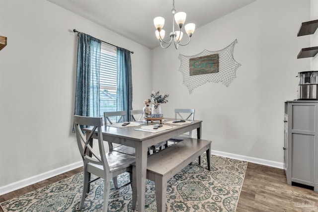 4744 Perception Cir, Milton, FL 32570 - dining area featuring a chandelier and wood finished floors