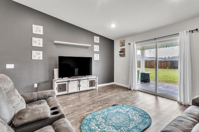 4744 Perception Cir, Milton, FL 32570 - living room with lofted ceiling, wood finished floors, and recessed lighting