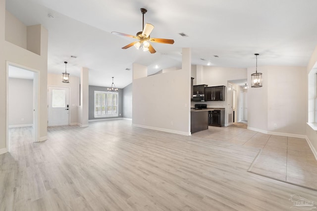 unfurnished living room featuring ceiling fan with notable chandelier, high vaulted ceiling, and light hardwood / wood-style flooring