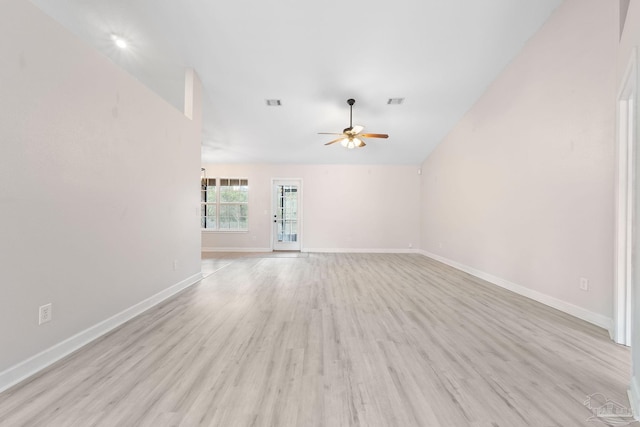 unfurnished living room featuring ceiling fan, vaulted ceiling, and light wood-type flooring